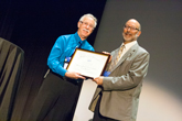 David Weintraub receives the Klopsteg Memorial Lecture Award fro AAPT Awards Chair, Steve Iona