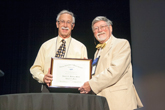Robert Morse is presented with the Millikan Medal by Steve Iona, Chair of the AAPT Awards Committee.
