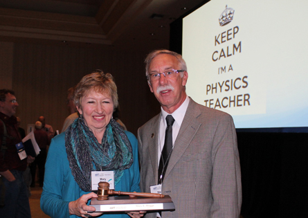 Steve Iona hands the Presidential Gavel to Mary Mogge, AAPT's 80th President.